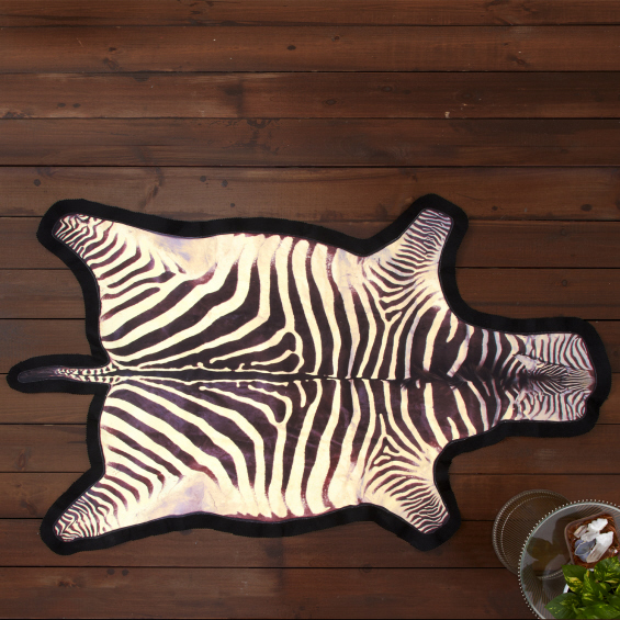 This faux zebra skin rug is made from common cowhide. So, you get the look of exotic without the guilt of taming such.