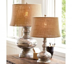 The warm luster of these mercury glass lamps highlight their classic silhouette. 